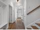 Bright hallway featuring hardwood floors, storage, coat hooks and stairs to the second floor at 625 Sienna Way, Summerville, SC 29486