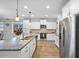 Well-equipped kitchen with stainless steel appliances, granite countertops, and ample cabinet space at 625 Sienna Way, Summerville, SC 29486
