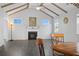 Living area with fireplace, cathedral ceiling and beams, hardwood floors and dining area at 625 Sienna Way, Summerville, SC 29486