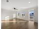 Open living room with hardwood floors, ceiling fan, and access to a balcony with a view at 625 Sienna Way, Summerville, SC 29486