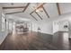 Open concept living room with cathedral ceiling, beams and hardwood floors leading to kitchen at 625 Sienna Way, Summerville, SC 29486