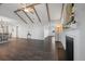 Spacious open-concept living area with hardwood floors and decorative ceiling beams at 625 Sienna Way, Summerville, SC 29486