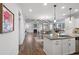 Bright open concept with granite island, cathedral ceiling, beams, fireplace and dining area at 625 Sienna Way, Summerville, SC 29486