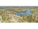 Aerial view of a community located on the water featuring many trees and landscaping on a sunny day at 659 Hamlet Cir, Goose Creek, SC 29445
