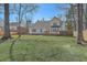 Expansive backyard featuring a wooden deck, lush lawn, and a wood fence at 659 Hamlet Cir, Goose Creek, SC 29445