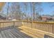 Wooden backyard deck featuring wood railing with large backyard and bordering neighborhood at 659 Hamlet Cir, Goose Creek, SC 29445