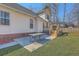 Open backyard patio with a wooden deck and metal table on a grassy lot at 659 Hamlet Cir, Goose Creek, SC 29445