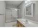 Clean bathroom features a shower-tub combo with sliding glass doors and vanity sink at 659 Hamlet Cir, Goose Creek, SC 29445