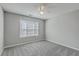 Cozy bedroom with carpet, ceiling fan, and window, creating a comfortable space at 659 Hamlet Cir, Goose Creek, SC 29445