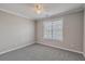Neutral bedroom with carpet, ceiling fan, and window offering natural light at 659 Hamlet Cir, Goose Creek, SC 29445
