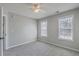 Inviting bedroom with carpet, ceiling fan, and two windows for ample sunlight at 659 Hamlet Cir, Goose Creek, SC 29445