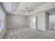 Spacious main bedroom with tray ceiling, fan, and en suite bathroom access at 659 Hamlet Cir, Goose Creek, SC 29445