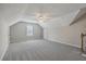 Attic converted to large living area features carpet, ceiling fan and stairway access at 659 Hamlet Cir, Goose Creek, SC 29445