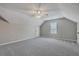 Spacious room featuring carpet, ceiling fan, dormered ceiling and natural light at 659 Hamlet Cir, Goose Creek, SC 29445