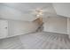 Large bonus room with gray carpet, ceiling fan, and stairs to another level at 659 Hamlet Cir, Goose Creek, SC 29445