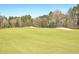 Exterior shot of golf course featuring sand traps and manicured green on a sunny day at 659 Hamlet Cir, Goose Creek, SC 29445