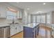 Spacious kitchen with stainless appliances, white cabinets, and eat-in breakfast nook with bright light at 659 Hamlet Cir, Goose Creek, SC 29445