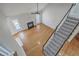 Bright living room featuring hardwood floors, fireplace, and staircase access at 659 Hamlet Cir, Goose Creek, SC 29445