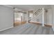 Spacious living room showcasing hardwood floors, columns, and staircase at 659 Hamlet Cir, Goose Creek, SC 29445