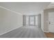 Bright and airy living room with neutral walls and large bay windows at 659 Hamlet Cir, Goose Creek, SC 29445