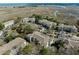 Aerial view of a community, with lush greenery, buildings, and waterways creating a serene environment at 700 Daniel Ellis Dr # 5302, Charleston, SC 29412