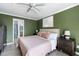 This bedroom is a peaceful retreat, featuring a ceiling fan and stylish artwork at 700 Daniel Ellis Dr # 5302, Charleston, SC 29412