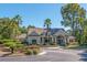 Clubhouse with a serene fountain, lush greenery, and palm trees, providing a picturesque community focal point at 700 Daniel Ellis Dr # 5302, Charleston, SC 29412