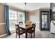 Dining room features a square wood table and an exterior view from a nearby window at 700 Daniel Ellis Dr # 5302, Charleston, SC 29412