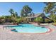 Community pool surrounded by lush landscaping and palm trees, perfect for relaxation and outdoor enjoyment at 700 Daniel Ellis Dr # 5302, Charleston, SC 29412