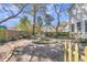 Spacious backyard with mature trees, landscaping, and privacy fence at 726 Gypsy Ln, Mount Pleasant, SC 29464