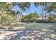 Large backyard with mature trees, open space, and patio area at 726 Gypsy Ln, Mount Pleasant, SC 29464