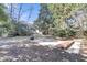 Backyard with mature trees, patio, and potential for outdoor entertaining at 726 Gypsy Ln, Mount Pleasant, SC 29464