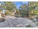 Spacious backyard patio area, perfect for entertaining or relaxing, surrounded by mature trees and lush foliage at 726 Gypsy Ln, Mount Pleasant, SC 29464