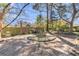 Large landscaped backyard featuring a tranquil water feature and mature trees at 726 Gypsy Ln, Mount Pleasant, SC 29464