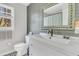 Bathroom with a large white vanity, decorative mirror, patterned tile floor, and lots of natural light at 726 Gypsy Ln, Mount Pleasant, SC 29464