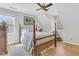 Cozy bedroom with a four poster bed, hardwood floors, neutral paint and lots of natural light at 726 Gypsy Ln, Mount Pleasant, SC 29464
