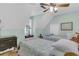 Bedroom featuring two twin beds with blue bedding, wood floors, neutral paint, and a ceiling fan at 726 Gypsy Ln, Mount Pleasant, SC 29464