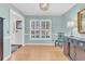 Light-filled dining room features shuttered windows, hardwood floors, and chandelier at 726 Gypsy Ln, Mount Pleasant, SC 29464