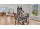 Spacious dining area with hardwood floors, stylish furnishings, and a seamless flow to the living room at 726 Gypsy Ln, Mount Pleasant, SC 29464