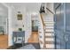 Open foyer with hardwood floors, staircase, and views into adjacent rooms at 726 Gypsy Ln, Mount Pleasant, SC 29464