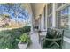 Relaxing front porch features comfortable seating and views of the surrounding neighborhood at 726 Gypsy Ln, Mount Pleasant, SC 29464