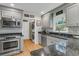 Stylish kitchen with black granite countertops, stainless steel appliances and lots of storage at 726 Gypsy Ln, Mount Pleasant, SC 29464