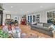 Bright living room featuring hardwood floors, comfortable seating, and a red piano at 726 Gypsy Ln, Mount Pleasant, SC 29464