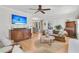 Comfortable living room featuring hardwood floors, a ceiling fan, and open access to other living spaces at 726 Gypsy Ln, Mount Pleasant, SC 29464