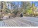 Large wooden deck overlooking the lush backyard, ideal for outdoor gatherings and enjoying the natural surroundings at 726 Gypsy Ln, Mount Pleasant, SC 29464