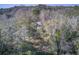 Aerial view of a quaint home nestled among trees, providing a serene and private retreat at 7759 Edingsville Beach Rd, Edisto Island, SC 29438