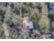 Aerial view of a home featuring lush greenery and a serene setting in a well-maintained landscape at 7759 Edingsville Beach Rd, Edisto Island, SC 29438