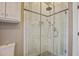 Stylish bathroom showcasing a glass shower with marble tile and a rain shower head at 7759 Edingsville Beach Rd, Edisto Island, SC 29438