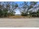 Scenic beach access point with mature trees and sandy path to the shore at 7759 Edingsville Beach Rd, Edisto Island, SC 29438