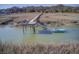 View of dock including a kayak lift, stairs to the dock, and waterfront scenery with tidal creek access at 7759 Edingsville Beach Rd, Edisto Island, SC 29438